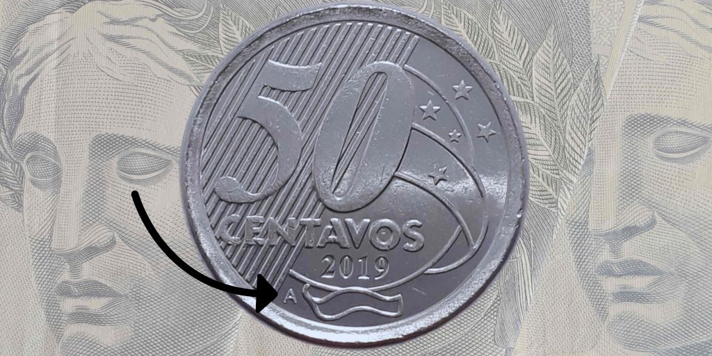 moeda de 50 centavos com a letra "A" moeda de 50 centavos com a letra "A"