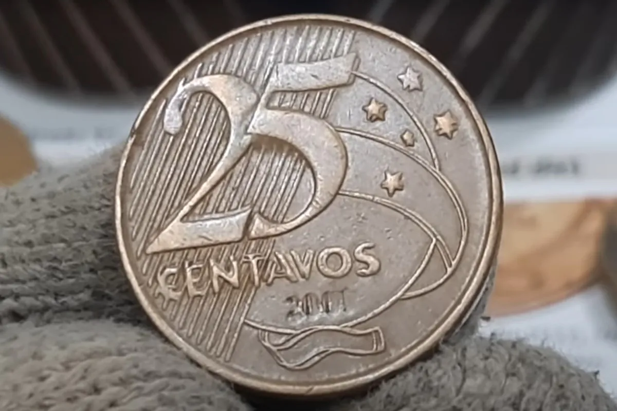 Moeda 25 centavos ombro duplo