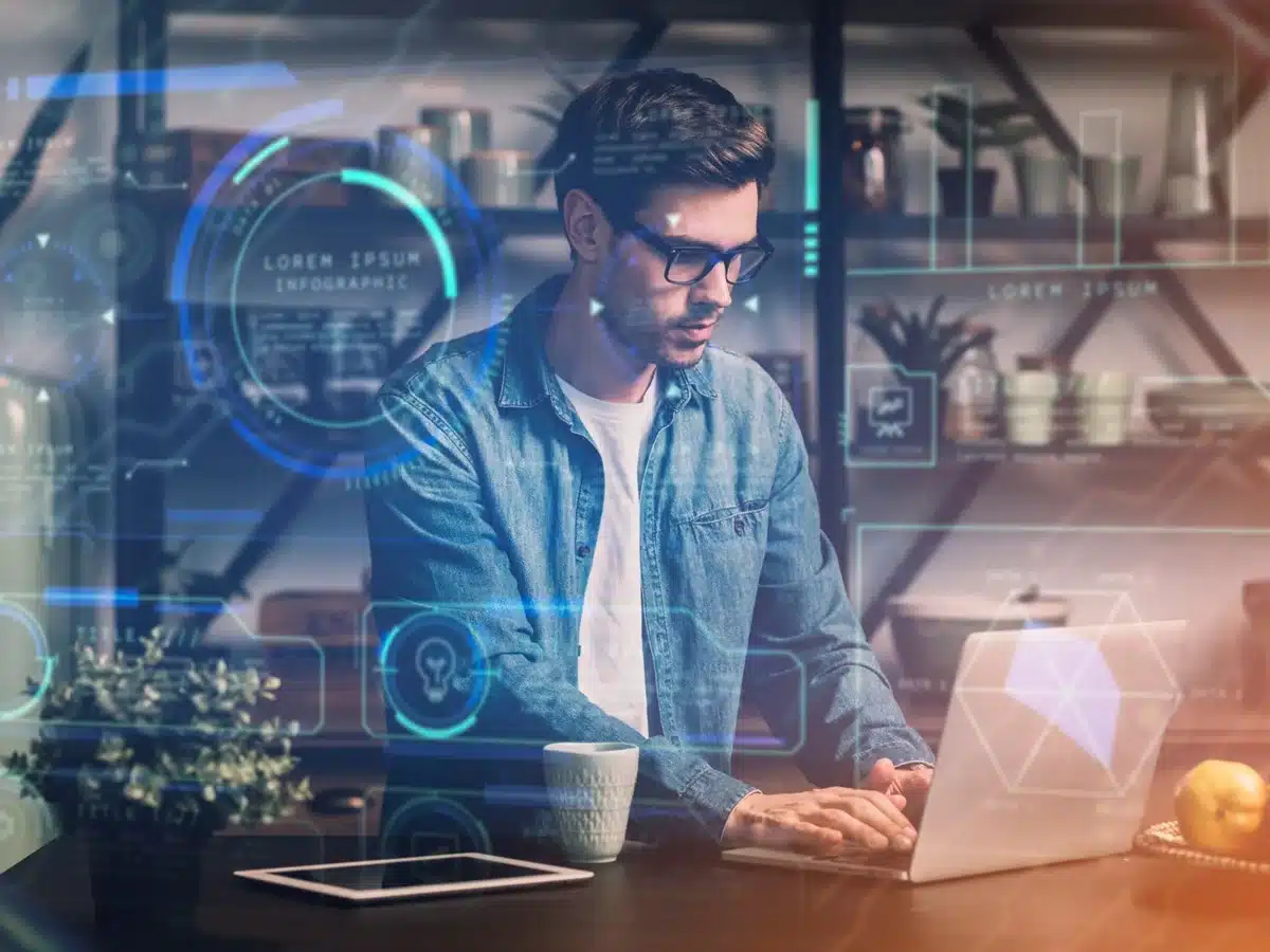 Machine Learning: Habilidade em Alta na Inteligência Artificial Profissional trabalhando em um computador com gráficos e dados relacionados ao Machine Learning, uma das habilidades de IA em alta.