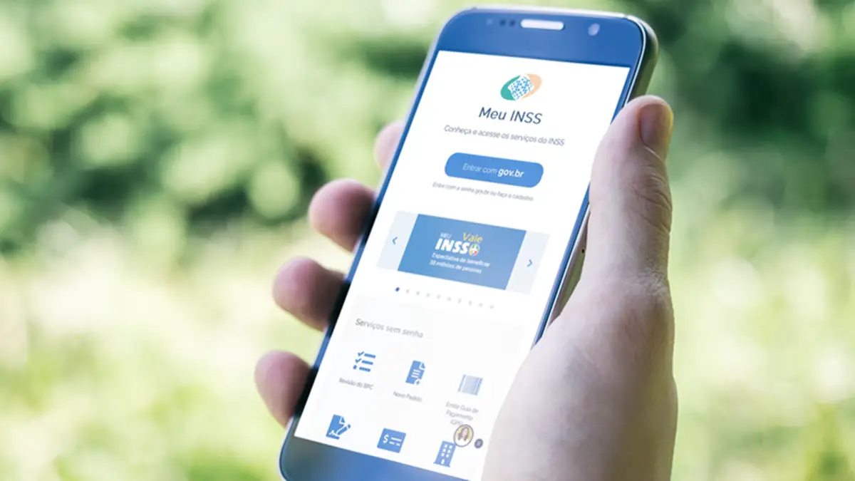 Como começar a usar? Tela do aplicativo Meu INSS exibida em smartphone, mostrando opções de serviços.