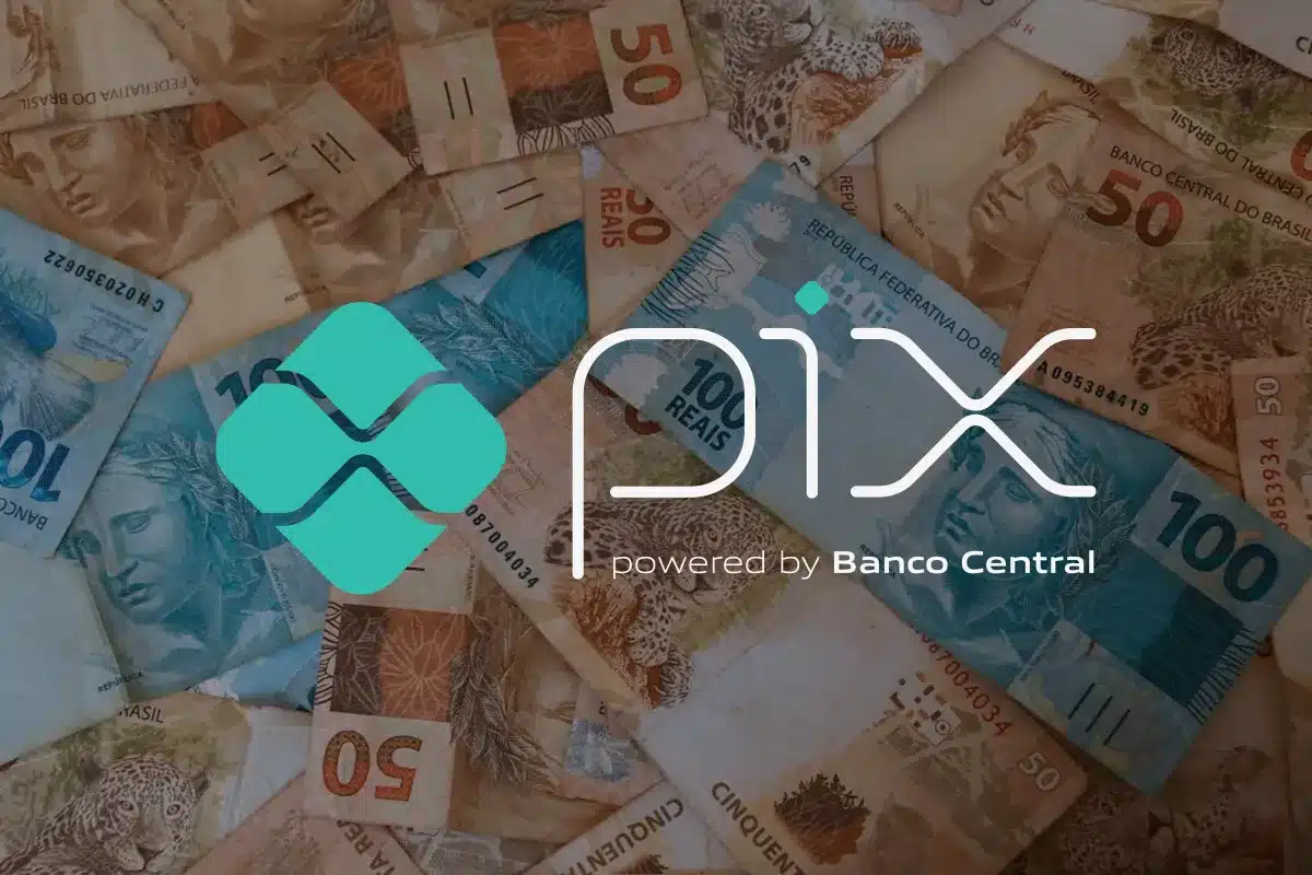Logotipo do PIX sobre notas de real, representando a transferência de R$ 150.