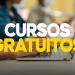 Pessoa mexendo no notebook, nome 'Concursos gratuitos' destacado.