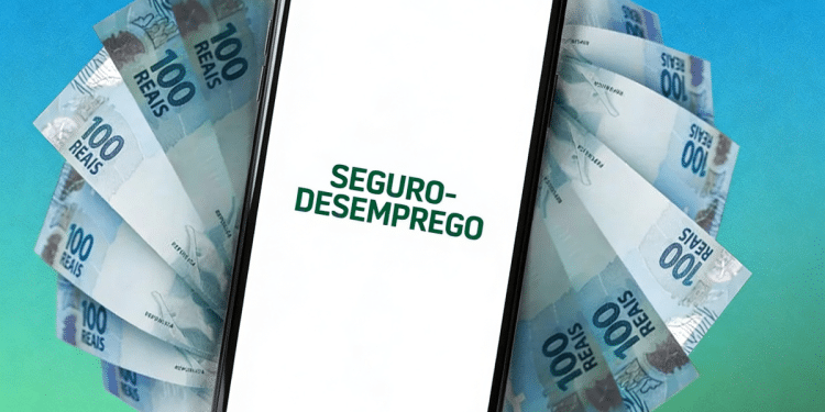 Smartphone exibindo texto "Seguro-Desemprego" sobre notas de 100 reais dispostas em leque.