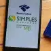 Smartphone exibindo logos da Receita Federal, Simples Nacional e Microempreendedor Individual ao lado de calculadora e agenda azul