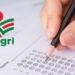 Mão preenchendo cartão-resposta com lápis ao lado do logotipo da Epagri.
