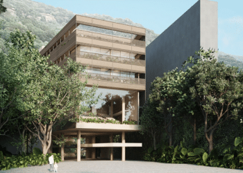 Imagem de projeto arquitetônico de um edifício moderno cercado por árvores e montanhas ao fundo, referência à instituição responsável pela oferta do curso gratuito