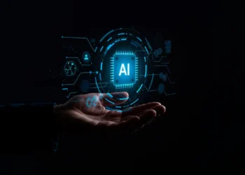Representação da inteligência artificial sobre uma mão humana, em referência ao debate sobre segurança e regulação da IA.